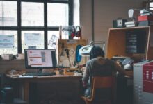 Graphic design jobs UK shocking truths - designer working at desk