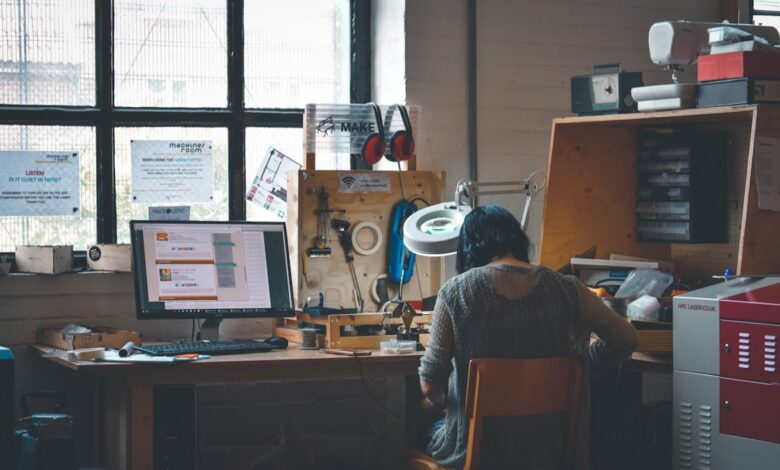 Graphic design jobs UK shocking truths - designer working at desk