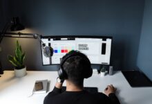 Transcription jobs UK - headphones and laptop for remote work