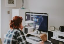 UK Virtual Assistant jobs - professional woman working remotely on computer