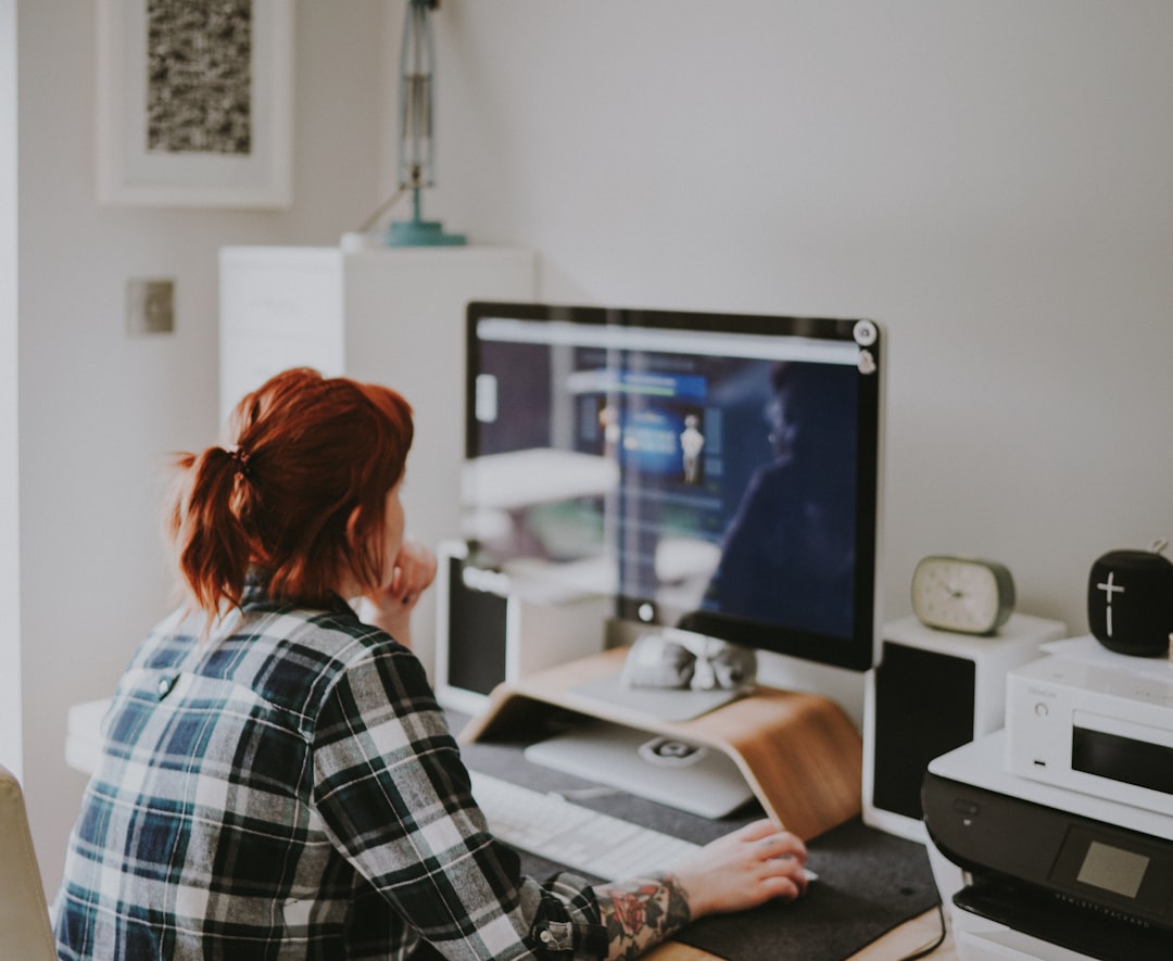 UK Virtual Assistant jobs - professional woman working remotely on computer